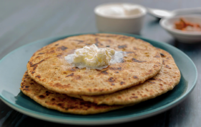 Whole Wheat Pyaj Paratha With Curd