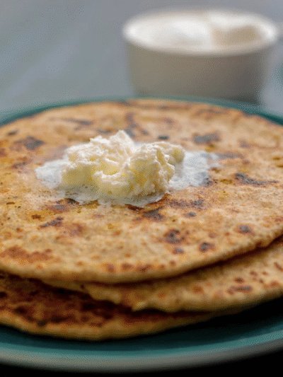 Whole Wheat Pyaj Paratha With Curd